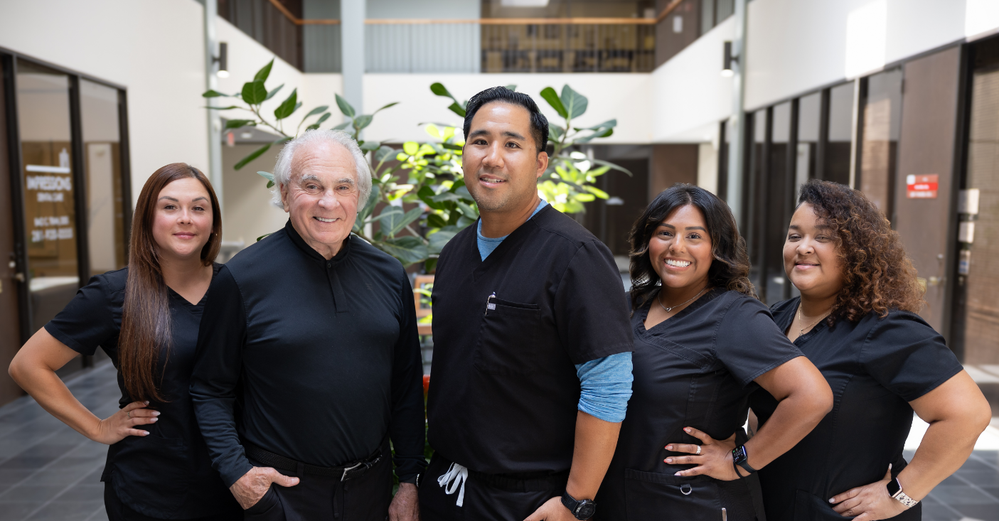 Dr Tran and Dr Frank with dental team