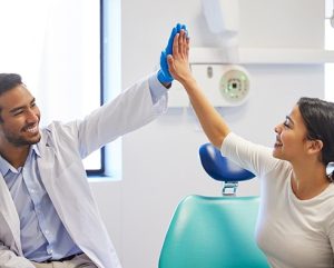 high fiving your dentist